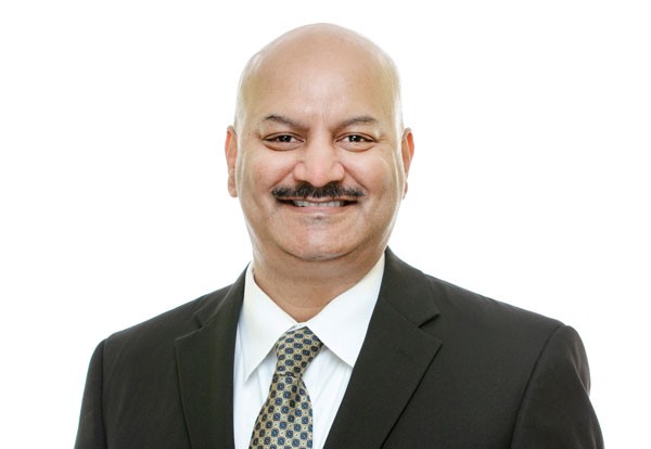 Bob Sarkar, a male in a dark suit and patterned tie